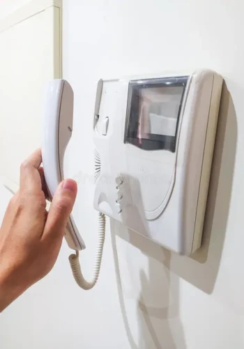 hand-holding-intercom-handset-white-wall-symbolizes-security-communication-access-control-use-articles-home-380702295